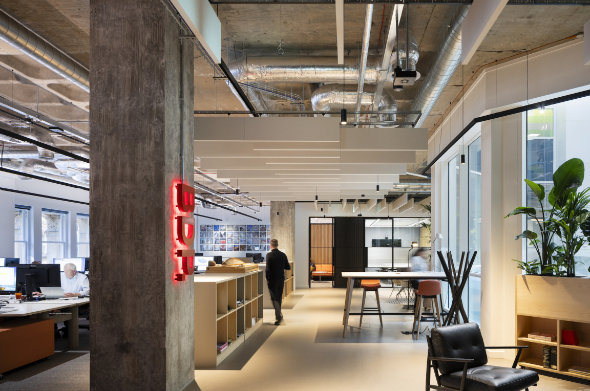 Modern office interior of BDP Glasgow in the historic Grosvenor Building, showcasing collaborative workspaces and design elements.