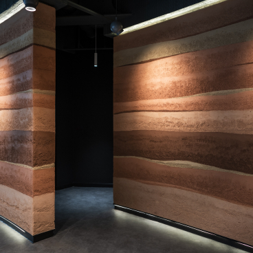 Rammed Earth Finish Sustainable Wall Surface - CBRE Glasgow. Credit: Alex Treadway