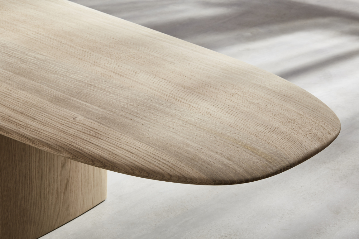 Elegant wooden table surface showcasing the craftsmanship of Benchmark, a winner in the UK's Wood Awards.