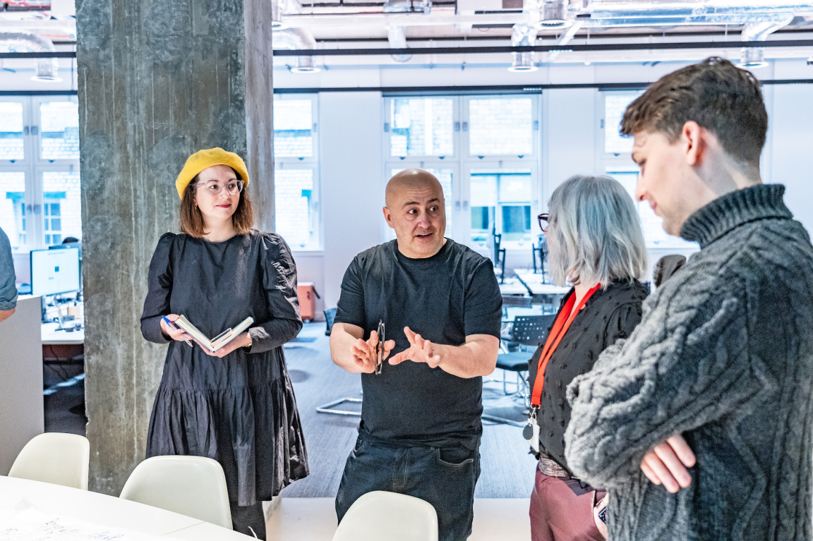 BDP Glasgow team engaging in a creative discussion at their new studio in the historic Grosvenor Building.