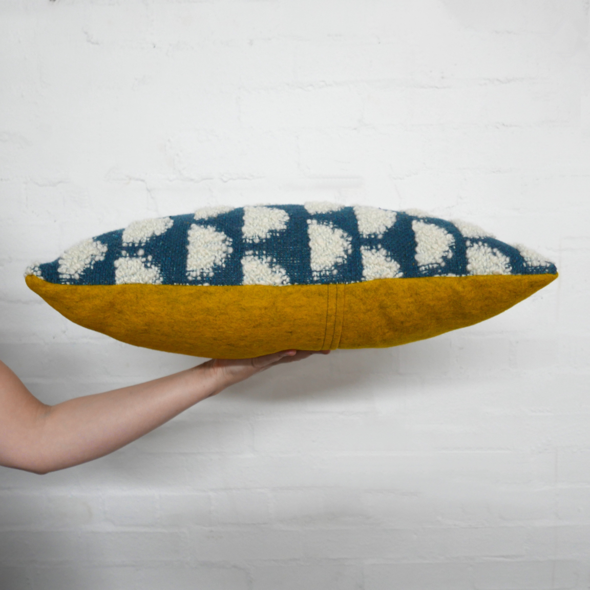 Handwoven Half Moon cushions, woven with a mixture of textural mohair loop yarn & lambswool and backed with 100% wool felt (Photographer: Mike Allen)