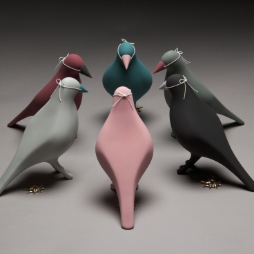 Colorful ceramic birds in various shapes and sizes, showcasing creative craft inspired by the North West of England.