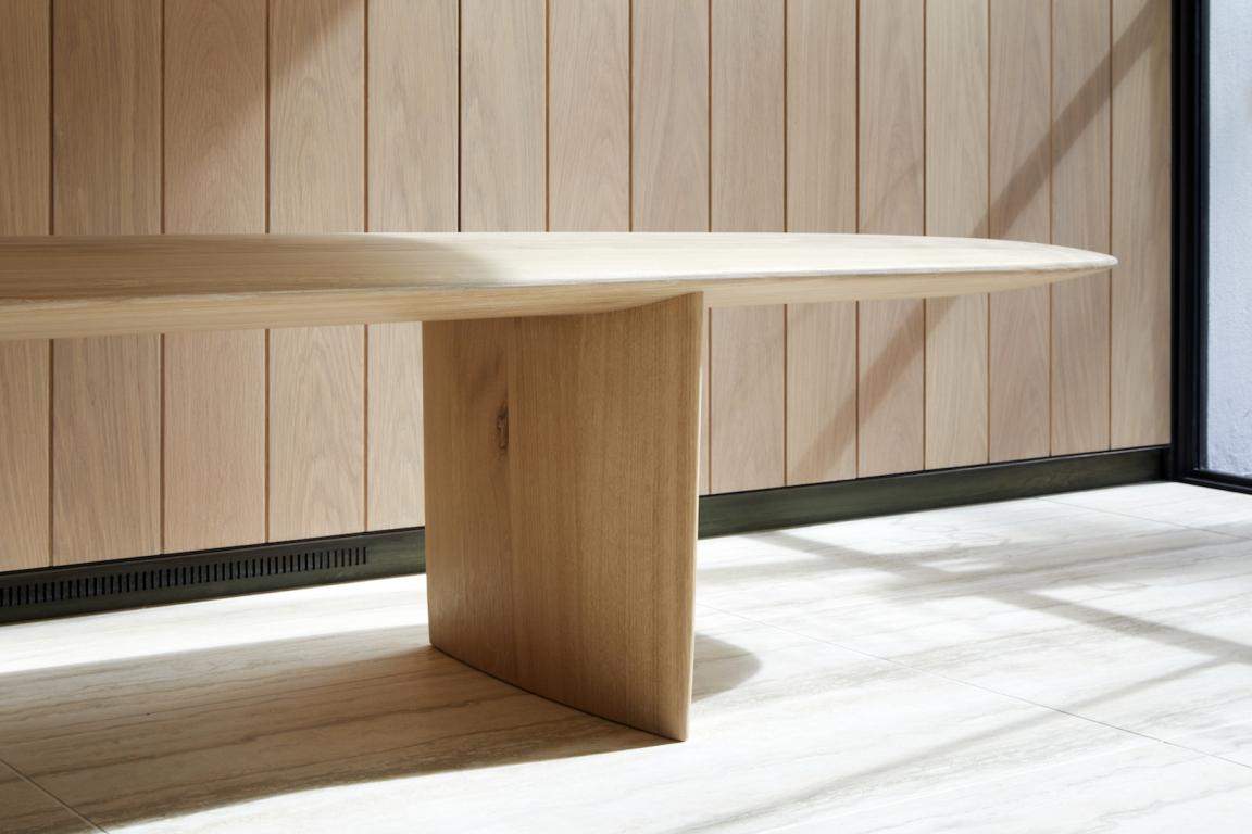 Sleek wooden table by Benchmark, showcasing modern design and craftsmanship, featured in the UK’s Wood Awards context.