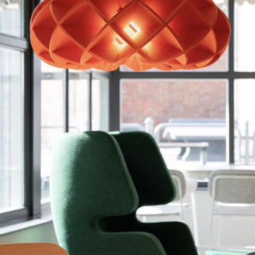 Halo light hangs above table and chairs