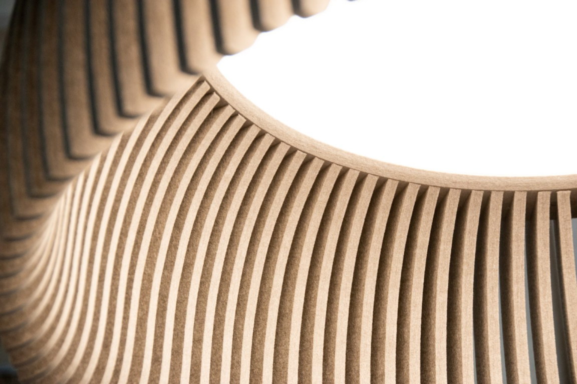 Lumenear's handcrafted acoustic lighting features a unique design with layered, curved wooden slats enhancing style and sound absorption.