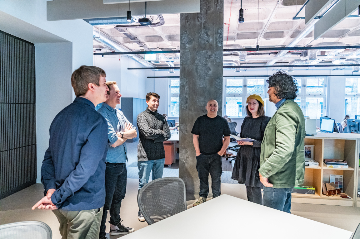 BDP Glasgow team members engaging in discussion at the new studio located in the historic Grosvenor Building.