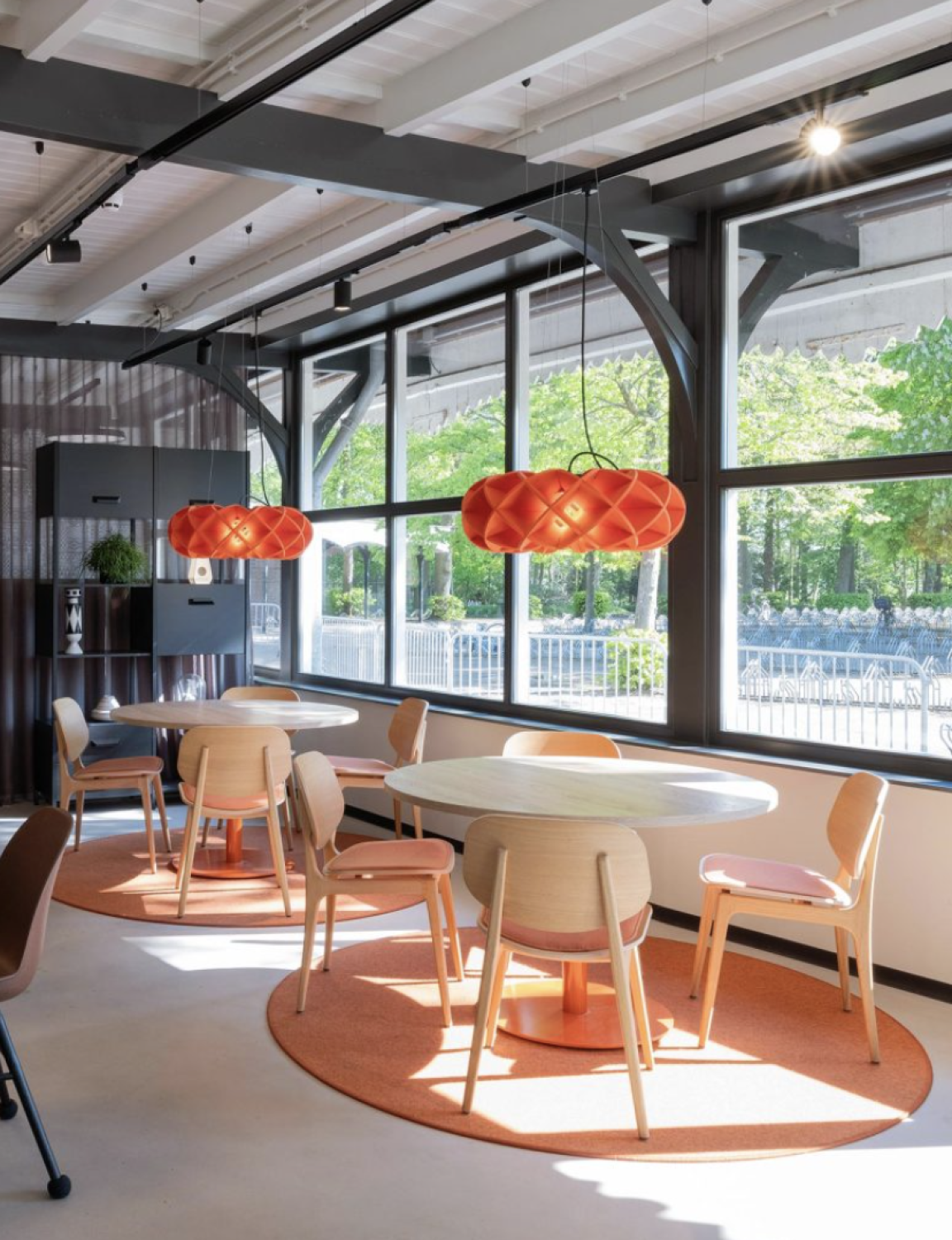 Halo light hangs above table and chairs