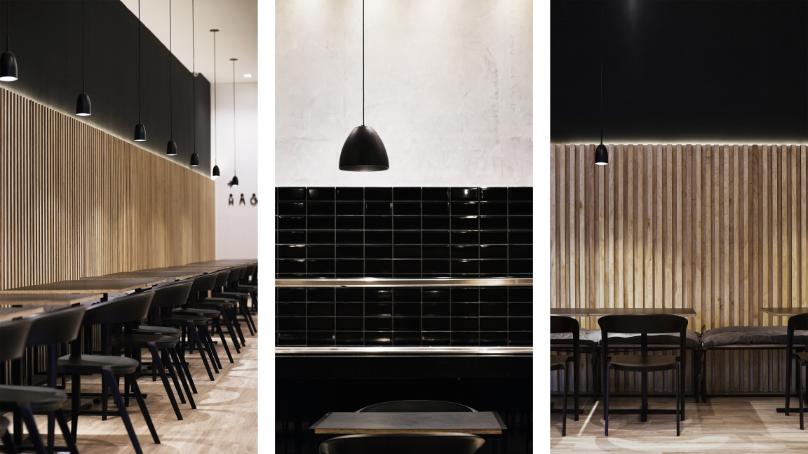 Modern Asian restaurant interior featuring natural wood accents, black tiles, and cozy lighting by Solo Arquitetos in Curitiba.