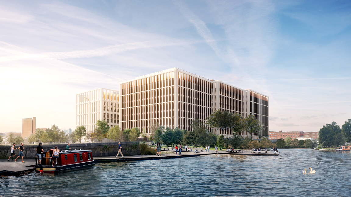 New Manchester Digital Campus features modern architecture by AtkinsRéalis, located along a picturesque waterfront, with people enjoying the area.