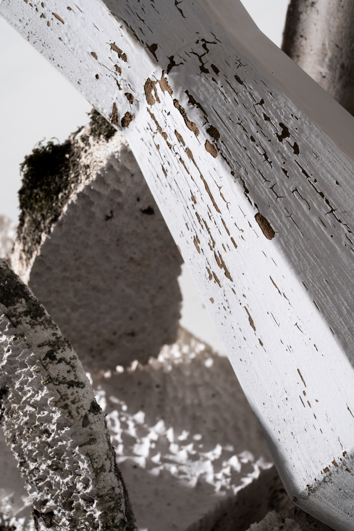 Close-up of textured white material and sculptural forms, showcasing innovative design from sustainable coffee waste recycling.