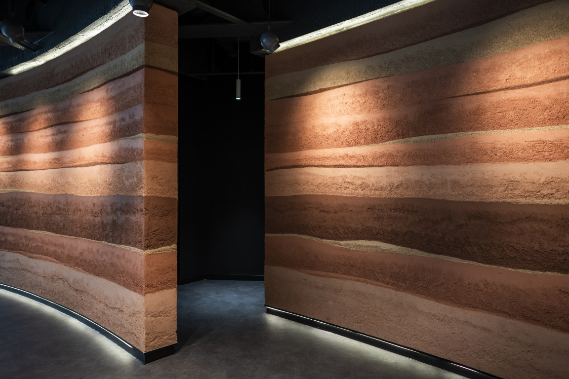 Rammed Earth Finish Sustainable Wall Surface - CBRE Glasgow. Credit: Alex Treadway