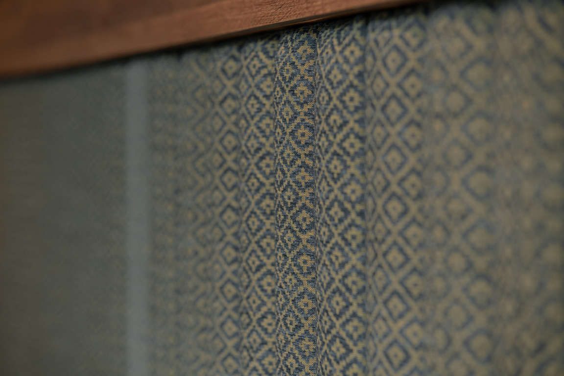 Textured fabric with intricate patterns in blue tones, showcasing the sophisticated interior scheme at The Place, Nottingham.