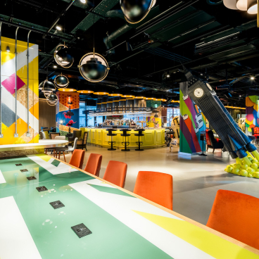 Vibrant interior of the nhow London hotel featuring unique London-inspired decor and a lively artistic atmosphere.