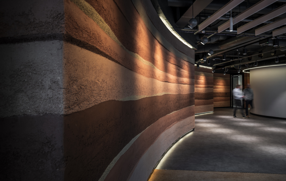 Rammed Earth Finish Sustainable Wall Surface - CBRE Glasgow. Credit: Alex Treadway