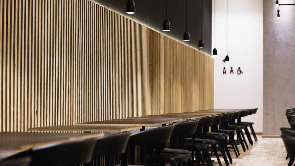 Elegant wooden accents and minimalist design characterize the interior of Maru Asian Cuisine, creating an inviting dining atmosphere.