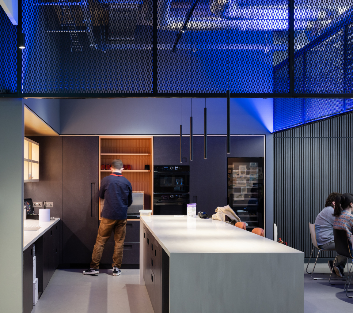 Modern kitchen in the BDP Glasgow studio, featuring sleek cabinetry and warm lighting, enhancing collaborative workspace design.