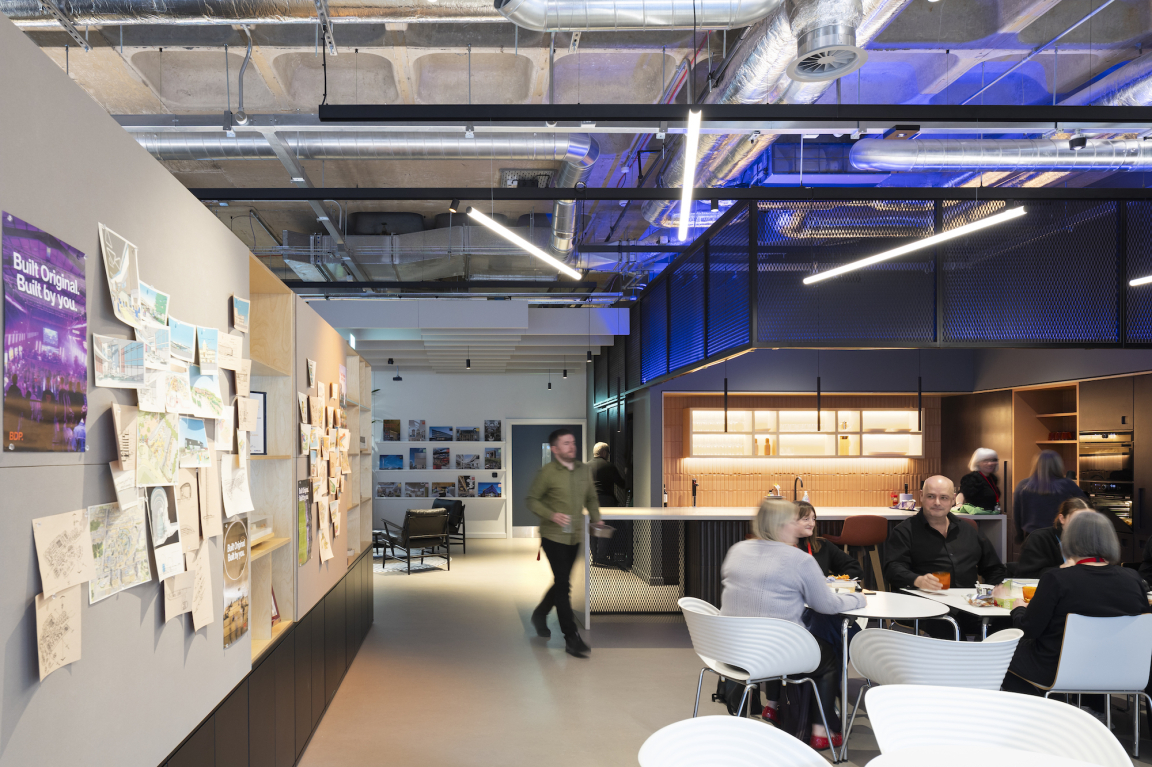 Modern workspace at BDP Glasgow's new studio, featuring collaborative areas and design sketches on display.