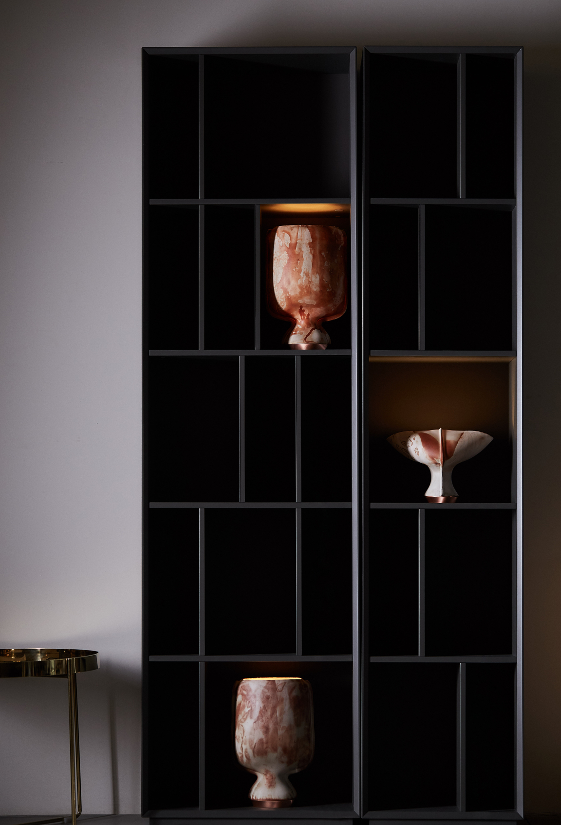 Showcasing elegant vases on a modern shelf, reflecting sustainable design and artistic craftsmanship in materials.